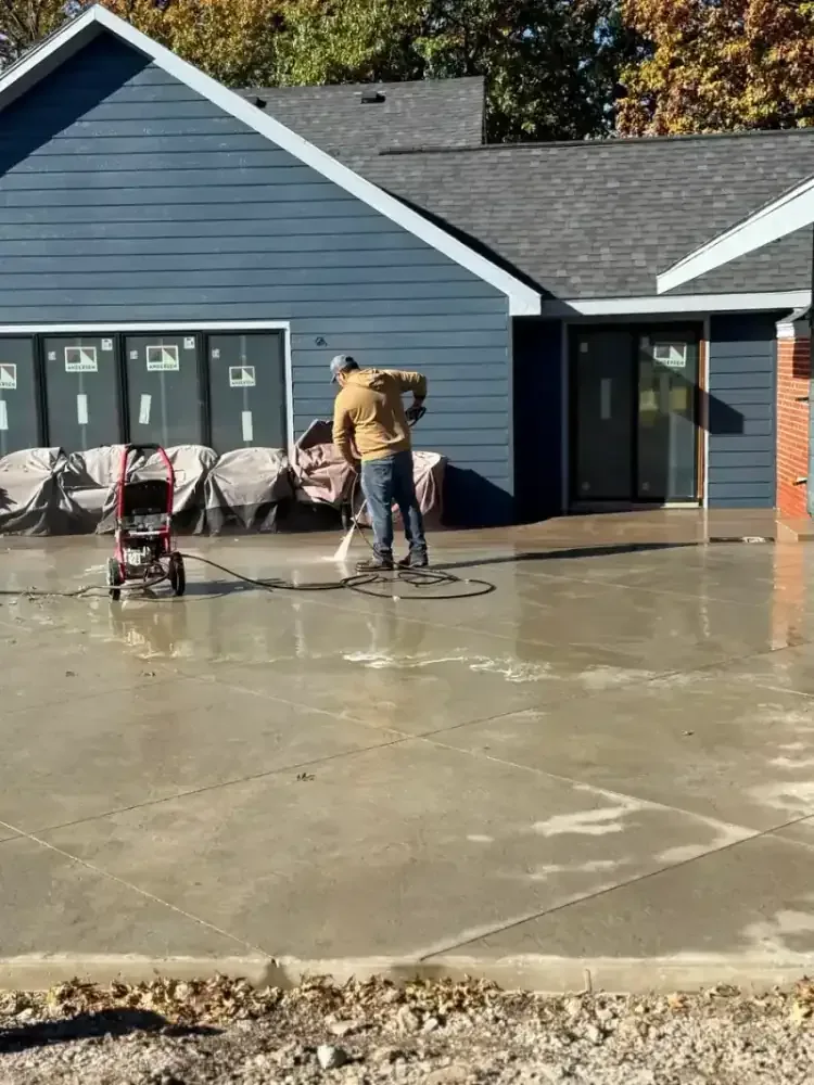 Stamped concrete patio installation around a pool area in Prairie Village