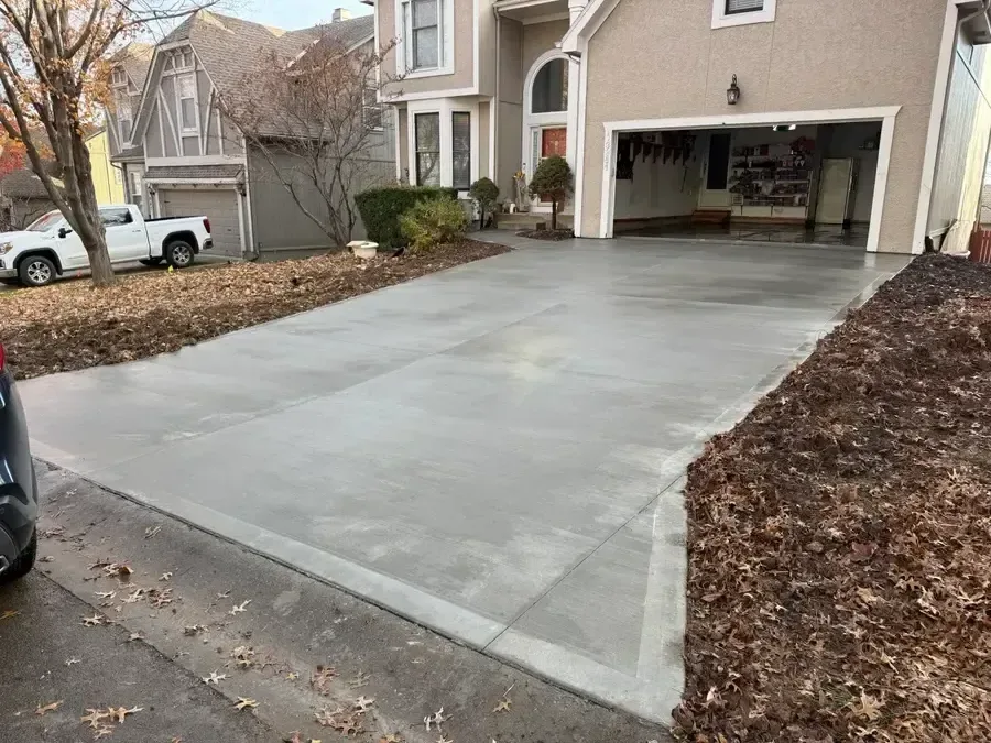 Fresh concrete driveway pour in progress — Independence, MO